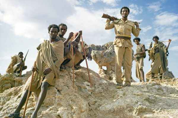 Ethiopia. Great Rift Valley. Danakil Depression (Afar Triangle). Danakil (Afar) nomads. gathered on a rock for a council.