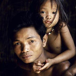 Indonesia. Borneo rain forest. Dyak manand daughter.